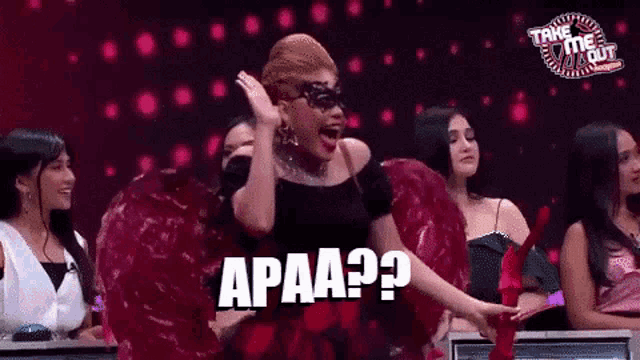 a woman in a masquerade costume says apaa on a television show
