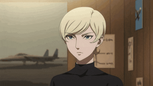 a woman with blonde hair and blue eyes is standing in front of a fighter jet