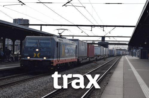 a train that says trax on the tracks