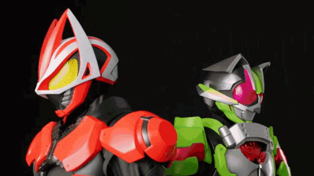 two action figures are standing next to each other with one wearing a red and white helmet