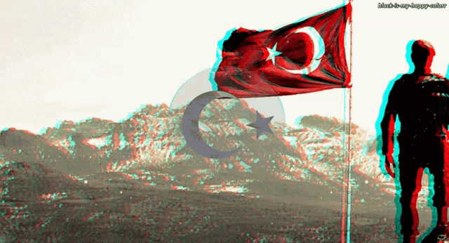 a man stands in front of a flag with a crescent moon on it