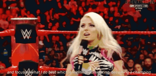 a woman in a wrestling ring is talking into a microphone with the words " and focus on what i do best "