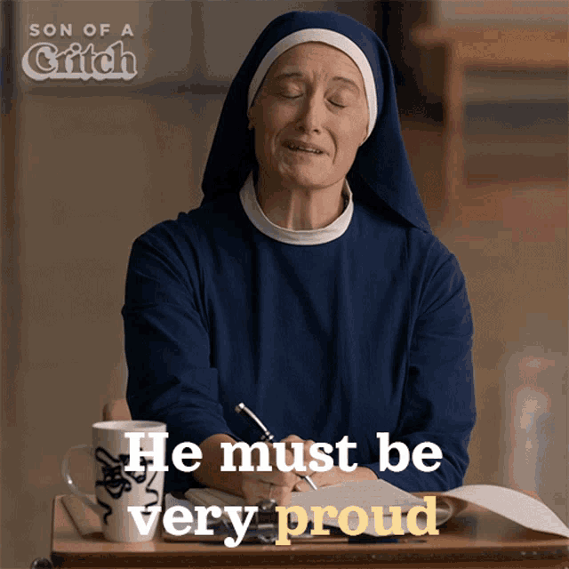a nun sitting at a desk with the words he must be very proud