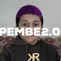 a young boy with purple hair is wearing a black hoodie and a hat .