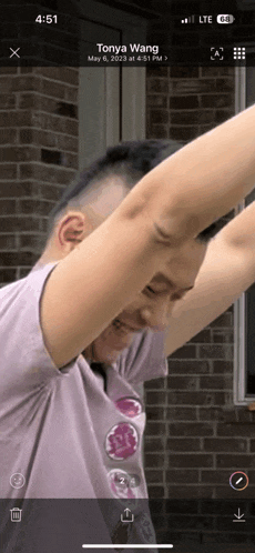 a phone screen shows a photo of tonya wang