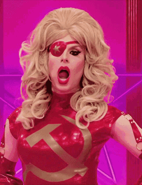 a woman in a red costume with a hammer and sickle on her chest