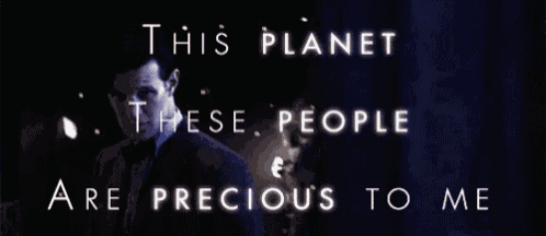 a man in a suit and tie with the words this planet these people are precious to me behind him