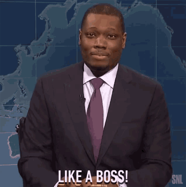 a man in a suit and tie says " like a boss " in front of a map