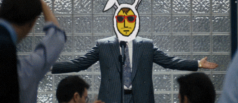 a man in a suit and tie with a cartoon face on his head