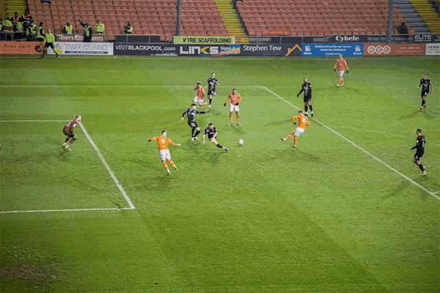 a soccer player wearing an orange jersey with the number 16 on it
