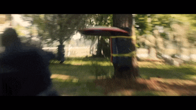 a blurry picture of a man holding a shield