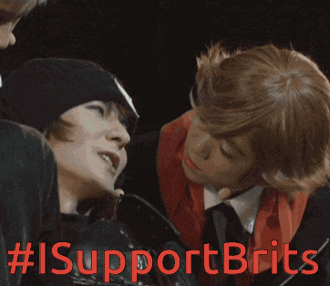 a man and a woman are looking at each other with the hashtag #isupportbrits written in red