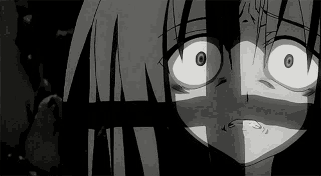 a close up of a person 's face with a shadow behind it