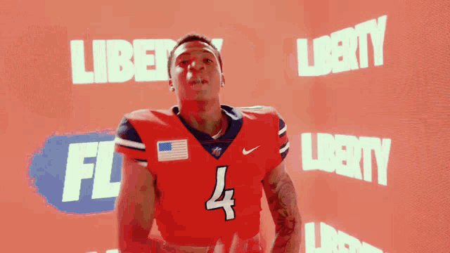 a football player in a red jersey with the number 4 on it