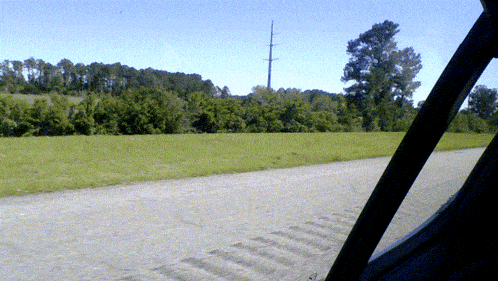 a view of a road from a car window