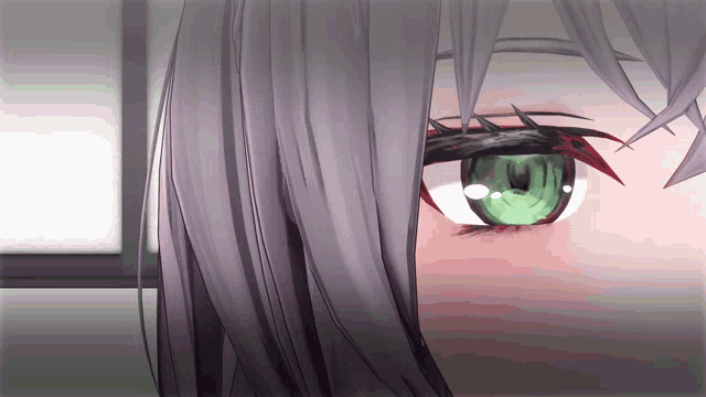 a close up of a girl 's green eye with red eyelashes