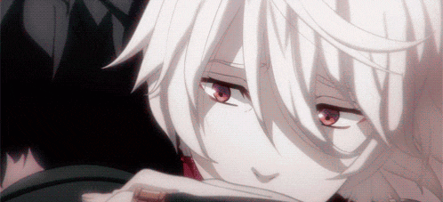 a close up of a person 's face with red eyes and white hair