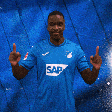 a man wearing a blue shirt with the word sap on the front