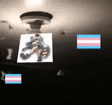 a picture of a girl with a transgender flag next to her