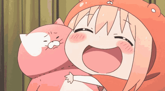 a girl in a bear hat is holding a pink cat