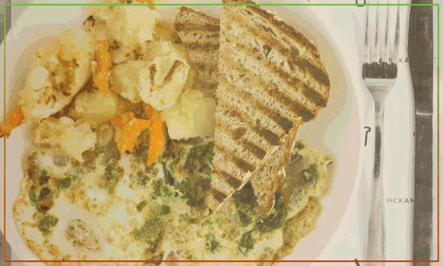 a plate of food with a fork and knife with the number 7 on it