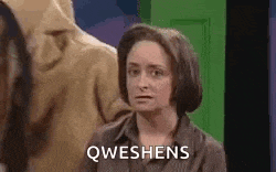 a woman is making a funny face and saying qweshens .