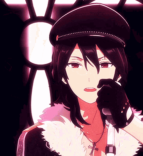 a girl in a hat is holding a microphone and wearing a cross necklace