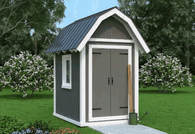 a gray and white shed with a black roof