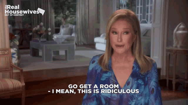 a woman says " go get a room " in front of a living room