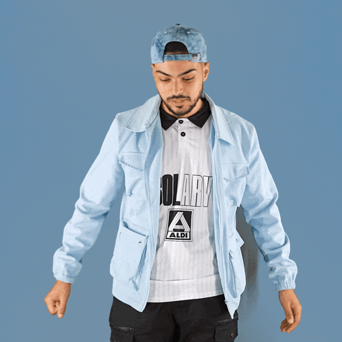 a man wearing a blue hat and a white shirt that says solary