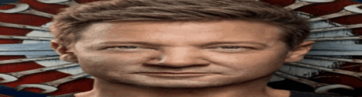 a close up of a man 's face in front of a dart board with wrenches on it