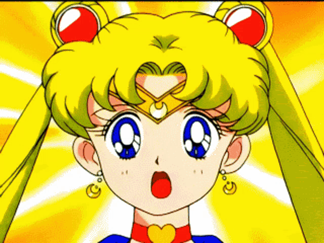 a close up of a sailor moon cartoon character