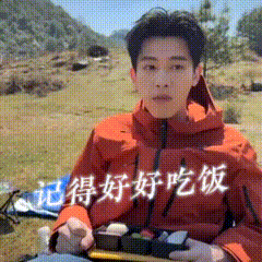 a man in an orange jacket is holding a box of food with chinese writing on it