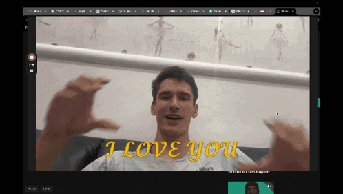 a computer screen shows a man with the words " i love you " on it