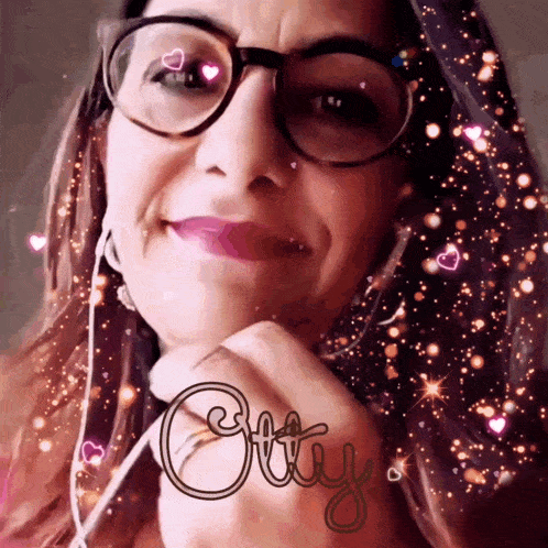 a close up of a woman wearing glasses and the word otty