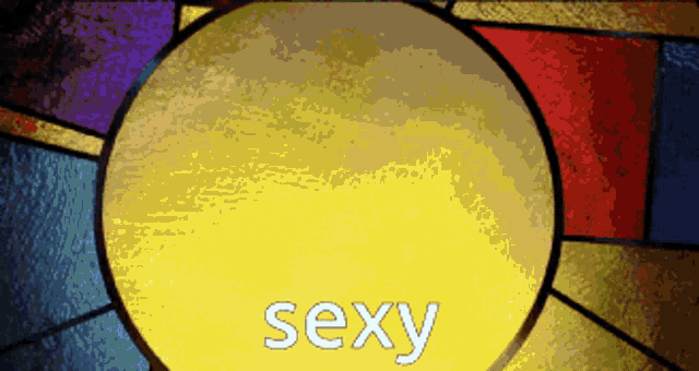 a stained glass window with the word sexy in white