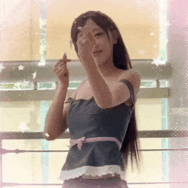 a woman making a heart shape with her fingers