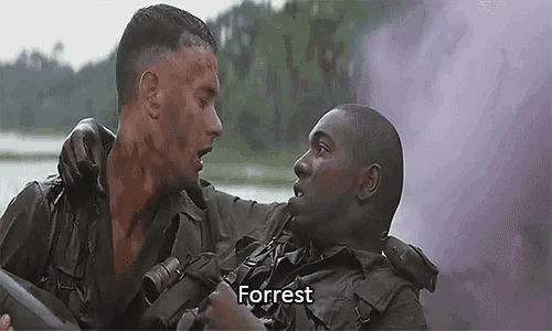 a man is holding another man 's arm in a movie .