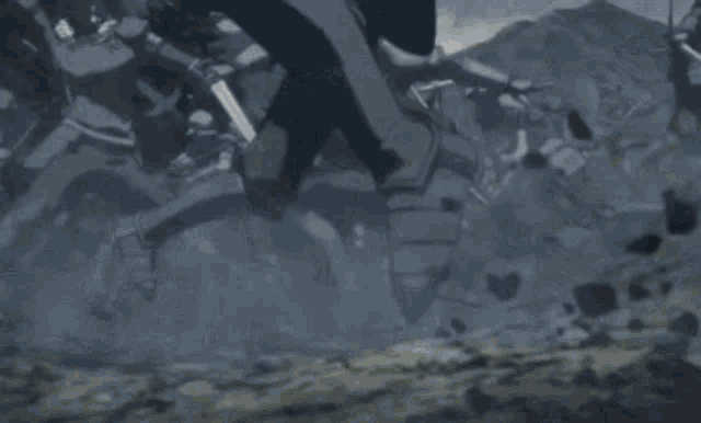 a group of soldiers are fighting with swords and axes in a video game .
