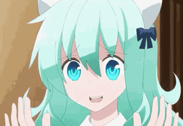 a girl with green hair and blue eyes is wearing a cat ears headband .