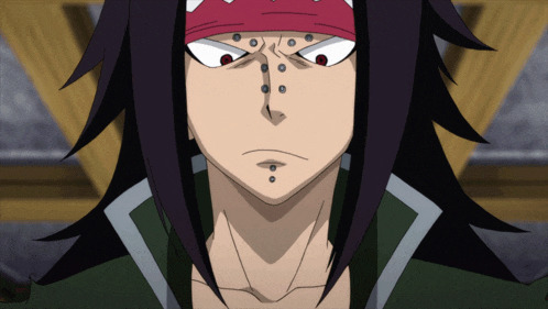 a close up of a person 's face with a red bandana around their head