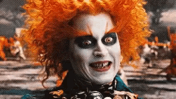 the mad hatter from alice in wonderland is wearing a wig and a bow tie .