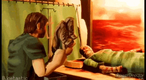 a man is standing next to a person laying on a table .
