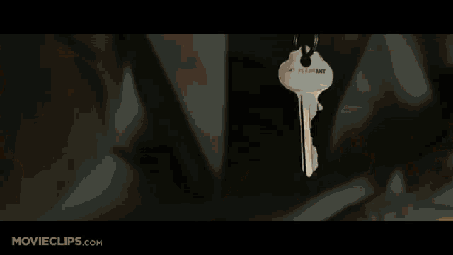 a movie clip from movieclips.com shows a woman standing in a room