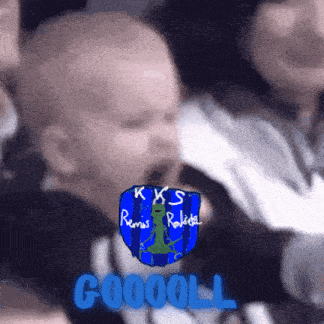 a baby is yawning in front of a kks emblem