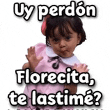 a little girl in a pink dress is making a funny face with the words `` uy perdon florecita , te lastime ? ''