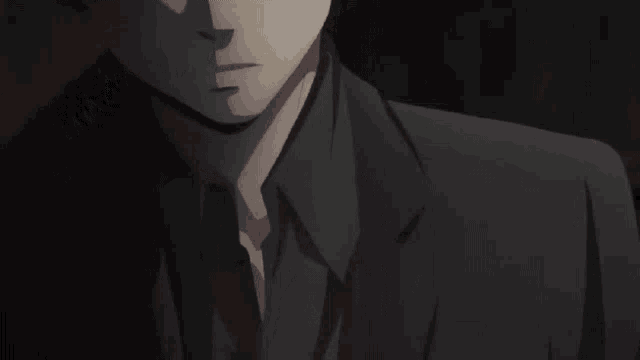 a close up of a man 's face with a dark background