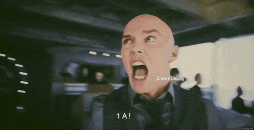 a man in a suit and tie is screaming with the words cinemacity below him
