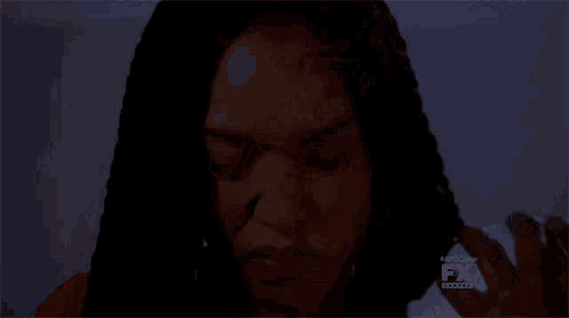 a close up of a woman 's face with fx written on the bottom right