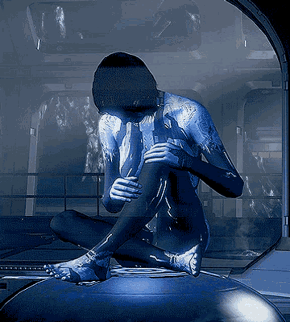 a person in a futuristic suit is sitting on a sphere